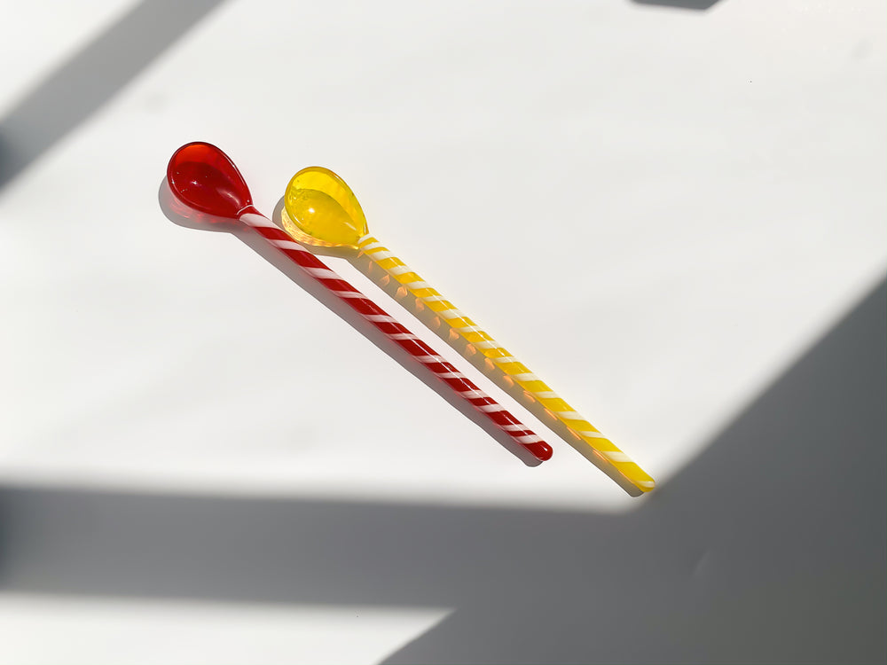 Glass stirrer and spoon set in red and yellow, two pieces
