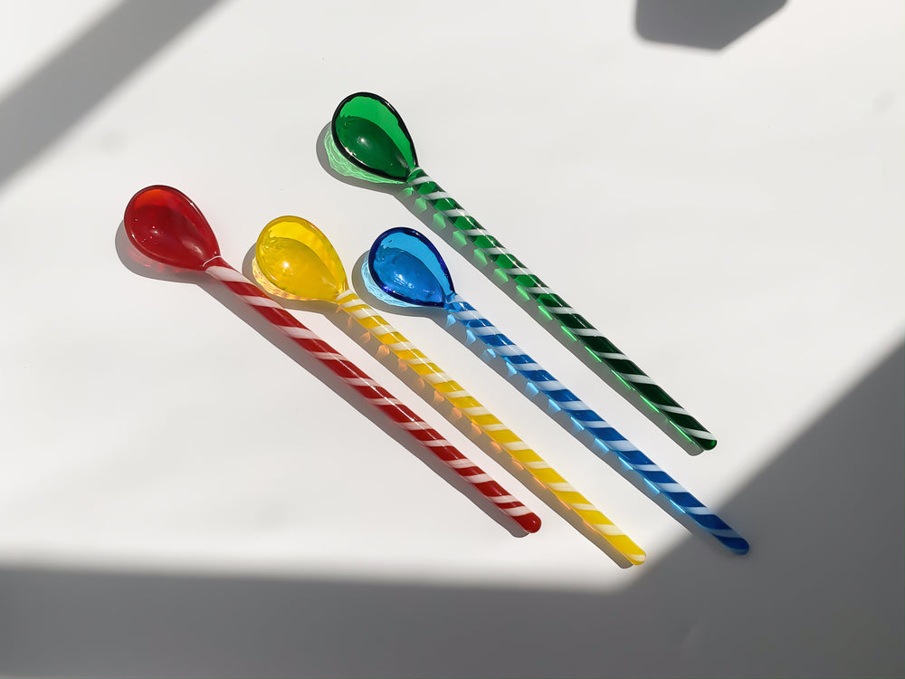Glass stirrers and spoons in red, yellow, blue and green